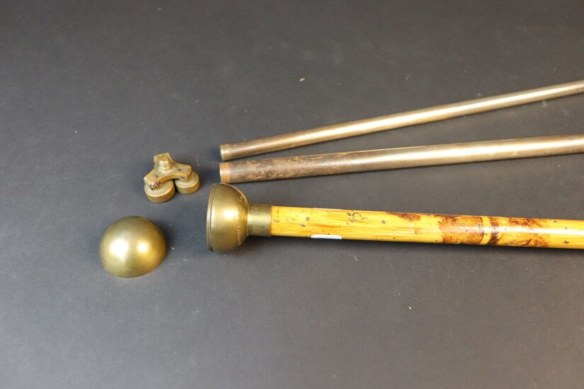 Cane with metal shaft painted in bamboo trompe-l'oeil. Brass knob unscrewing to release a set of tubes making camera feet. Marked: "Mackenstein Paris Breveté en France et à l'étranger". End of XIXth century