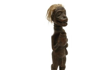 Carved Wood African Figure with Blonde Hair.