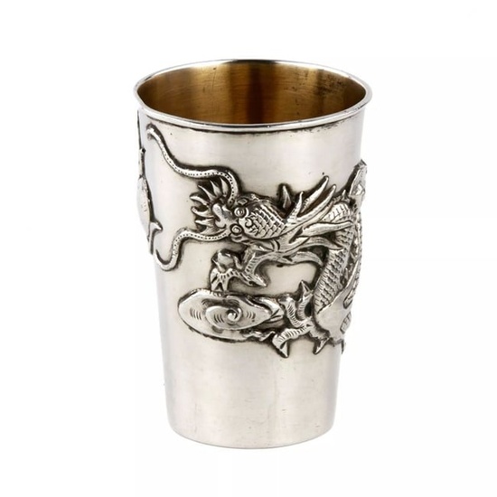 Chinese silver glass with a dragon.