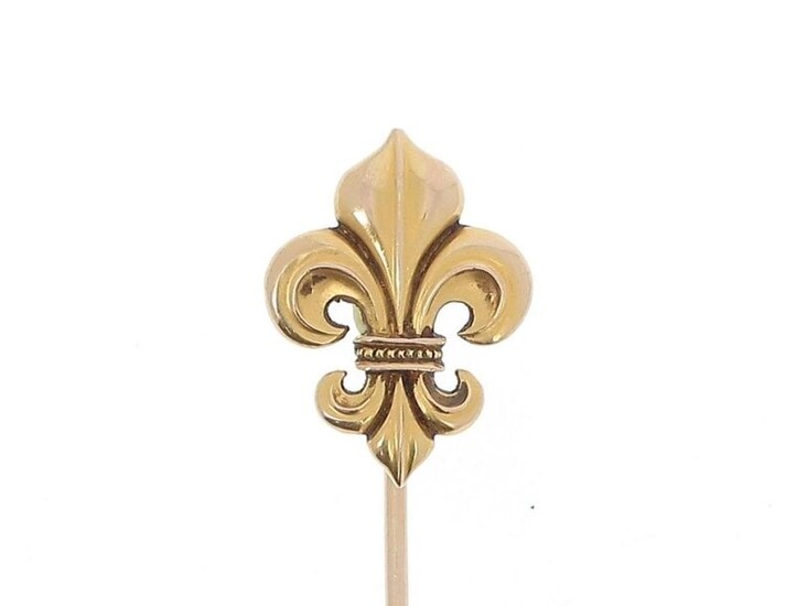 Costume pin in 18k (750 thousandths) yellow gold, the tip decorated with fleur-de-lys.