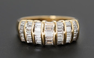 SOLD. Damiani: A diamond ring set with numerous baguette-cut diamonds weighing a total of app. 1.70 ct., mounted in 18k gold. Size 53. – Bruun Rasmussen Auctioneers of Fine Art