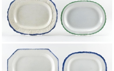 FOUR ENGLISH POTTERY PLATTERS Three with blue borders and one with a green border. Lengths from 16" to 17".