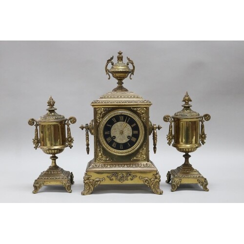 French brass mantle clock with pair of garnitures, with Fren...