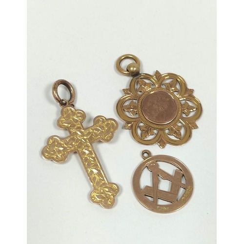 Gold engraved cross and two medallions all 9ct. 12.7g.