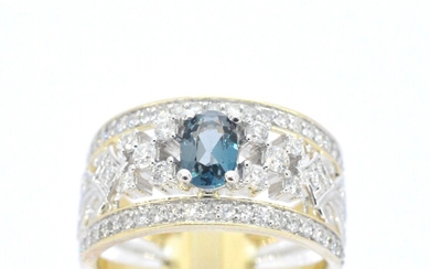 Gold exclusive ring full of diamonds and a gemstone