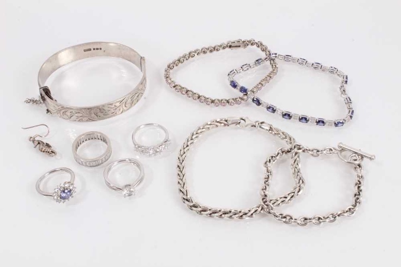 Group of silver jewellery to include a bangle with engraved scroll decoration (Birmingham 1981), two gem set bracelets, two other chain bracelets, four gem set rings and one seahorse earring