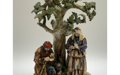 Gruppo in porcellana policroma raffigurante mendicanti sotto un albero (h cm 24) (difetti e mancanze)