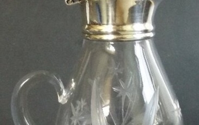 Hand cut glass cruet with sterling silver base and lid
