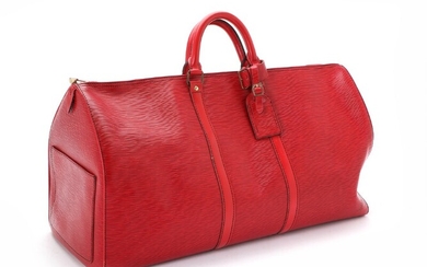 SOLD. Louis Vuitton: A "Keepall Black Stitching 55" of red Epi leather with one large...