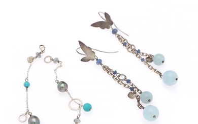 Marianne Dulong: A jewellery set comprising a pair of ear pendants and a bracelet partly set a.o. with aquamarine, iolite, mounted in sterling silver. (3)