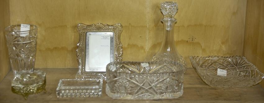 One shelf of cut glass decorative items