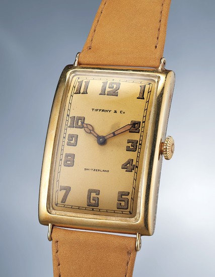 Patek Philippe, A highly rare and attractive yellow gold rectangular wristwatch with champagne dial, luminous hands and numerals