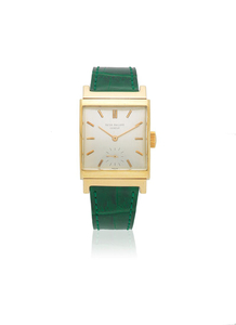 Patek Philippe. An 18K gold manual wind curved rectangular wristwatch