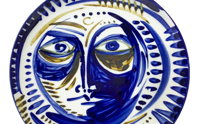 Piatto da muro in porcellana raffigurante volto nei toni del blu. nello stile...