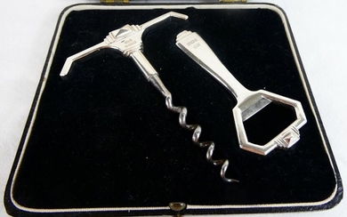 Quality Art Deco sterling silver corkscrew and bottle opener in their original fitted case. Clear hallmarks for Birmingham 1933 by William Suckling Ltd. Total weight 114 grammes. Corkscrew 8cm Wide, 11cm Tall. Bottle Opener 4cm Wide, 8.5cm tall.