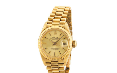 Rolex. A fine lady's 18K gold automatic calendar bracelet watch...