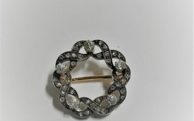Round brooch in gold (750) and silver (800)...