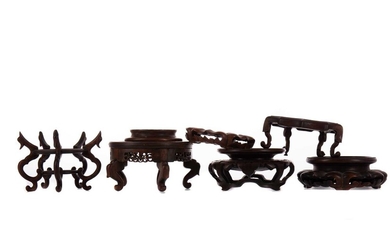 SIX CHINESE CARVED HARDWOOD STANDS