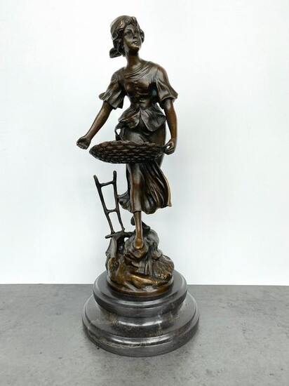 Sign. Bronze statue "The Sower" with marble base