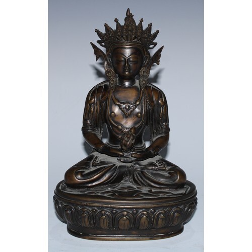 Sino-Tibetan School, a brown patinated bronze, of Buddha, cr...