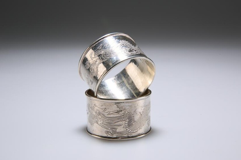 TWO CHINESE SILVER NAPKIN RINGS, of circular form, the