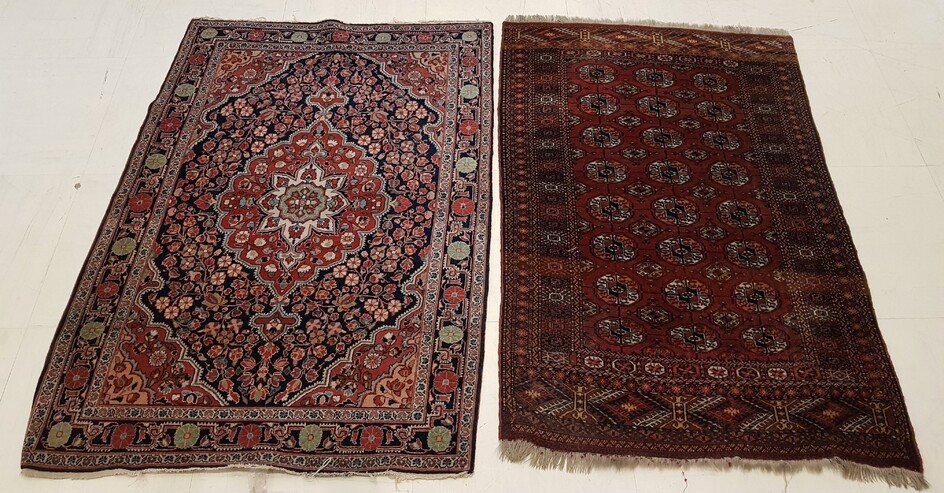 TWO HAND-KNOTED RUGS, one decorated with stylized flowers (Length 154...