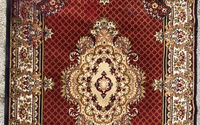 Tapis mécanique en laine à décor d'un médaillon... - Lot 1033 - De Baecque et Associés