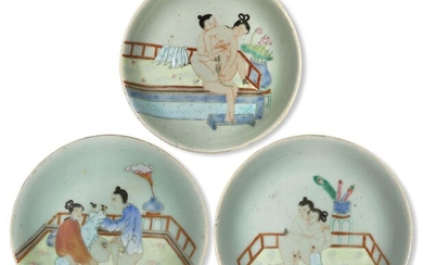 Three Chinese porcelain celadon-ground famille rose 'erotic' dishes, late 19th century, each painted with an amorous couple, 17cm-18.5cm diameter (4)