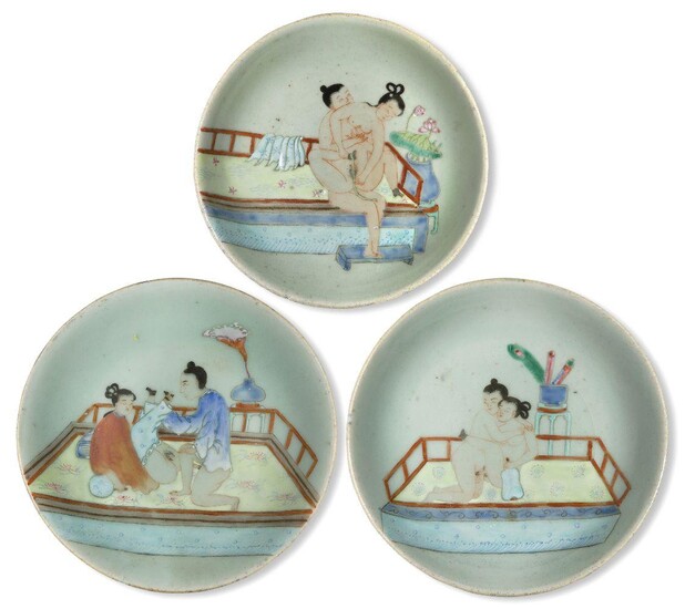Three Chinese porcelain celadon-ground famille rose 'erotic' dishes, late 19th century, each painted with an amorous couple, 17cm-18.5cm diameter (4)