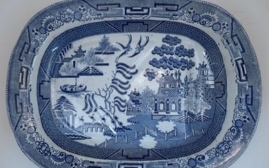 Three Victorian blue and white transfer print meat plates, to include: a hexagonal example decorated with an English classical landscape to the well, with foliate decorated border to the rim, 50.5cm long; and two oval Chinoiserie examples decorated...
