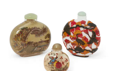 Three large Chinese glass snuff bottles, 20th century, comprising a black, red...