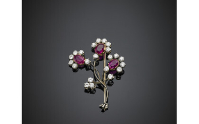 Three oval ruby and diamond bi-coloured gold flower brooch, ruby in all ct. 3.10 circa and diamonds in all ct....