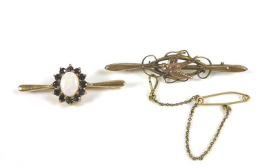 Two 9ct gold bar brooches, comprising a brooch with a swallo...