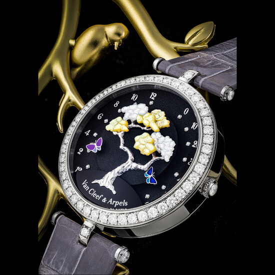 VAN CLEEF AND ARPELS. A LADY’S ELEGANT 18K WHITE GOLD AND DIAMOND-SET BI-RETROGRADE WRISTWATCH WITH ONYX AND MOTHER-OF-PEARL DIAL BUTTERFLY SYMPHONY, CIRCA 2015