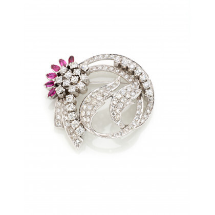 White gold floral brooch with round diamonds and synthetic rubies, diamonds in all ct. 3.60 circa, g 14.36 circa, diam....