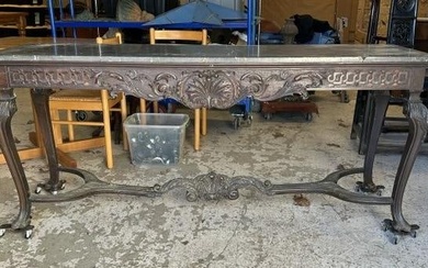 Wonderful carved marble top console table, carved on all sides and stretcher on base. Has claw feet.