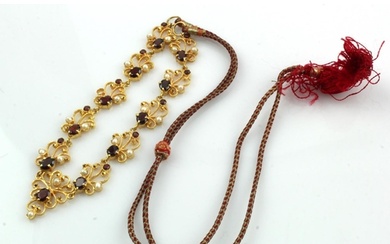 Yellow gold (tests 18ct) necklace, stones include garnets an...