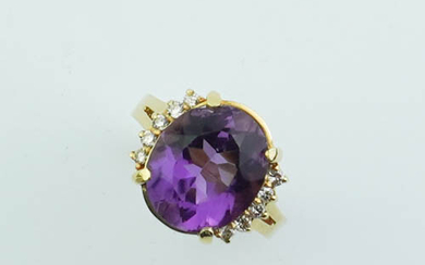14K YELLOW GOLD, DIAMOND AND AMETHYST RING. Oval amethyst weighing...