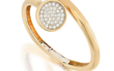 An 18k gold and diamond bangle