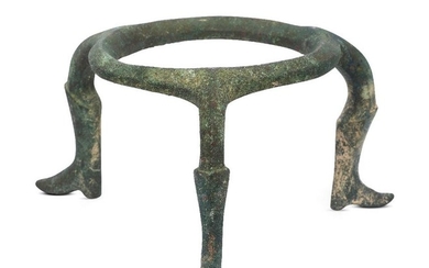 An Amlash bronze tripod, 1st millenium B.C.,...