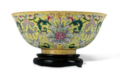 A CHINESE YELLOW GROUND FAMILLE ROSE 'LOTUS' BOWL.