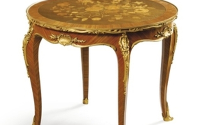François Linke (1855 - 1946) A French gilt-bronze mounted tulipwood, sycamore and amaranth low table, Paris