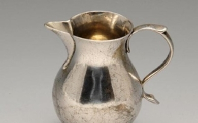 A George II silver sparrow beak cream jug, the typical