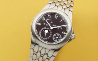 Patek Philippe. A stainless steel automatic calendar bracelet watch with moon phase and power reserve