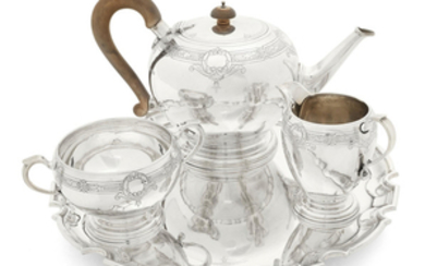 A silver three-piece tea service and a matched tray