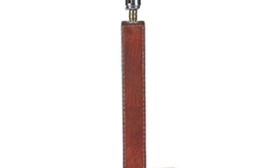 A stitched red leather table lamp In the manner...