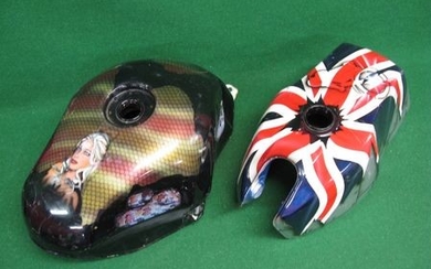 Two motorcycle fuel tanks with eye-catching artwork