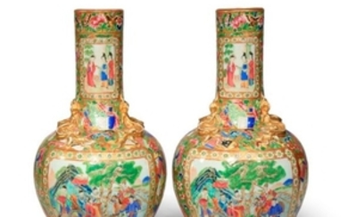A PAIR OF CHINESE CANTON FAMILLE ROSE BOTTLE VASES…