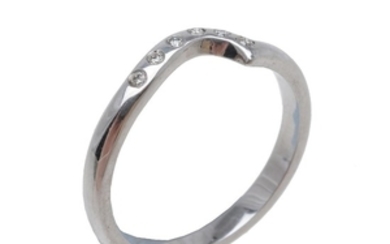 A shaped diamond band ring