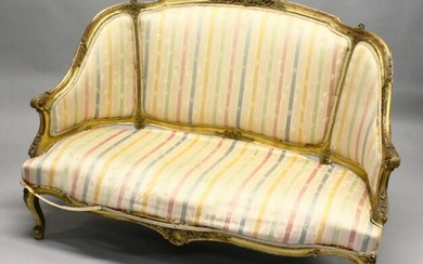 A 19TH CENTURY FRENCH GILTWOOD CANAPE, with later